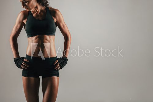 Athletic woman with strong abdominal muscles