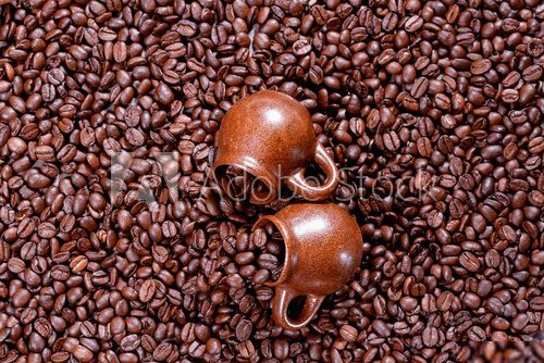 Background of coffee beans with cup