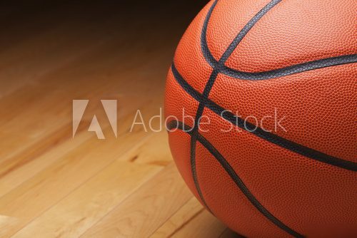 Basketball shot close up on hardwood gym floor