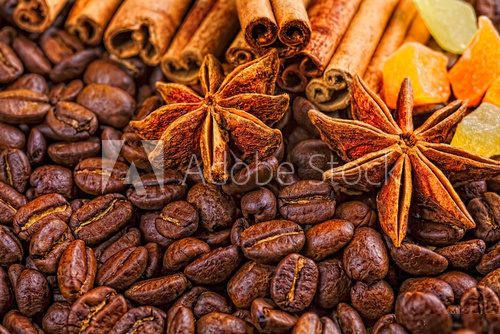 Coffee cup, spices and chocolate on wooden table texture with co