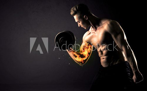 Bodybuilder athlete lifting weight with fire explode arm concept