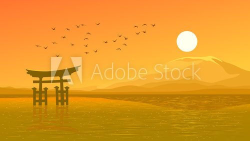Flying birds against orange sunset ocer coast Japanese gate (Tor