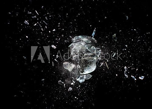 glass breaking black background. creativity fragility abstract