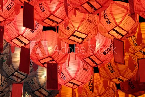 Glowing red, pink and yellow lanterns in night