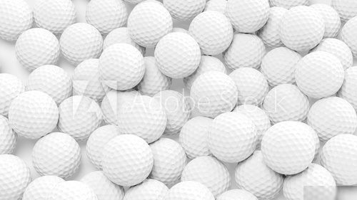 Many golf balls together closeup isolated on white