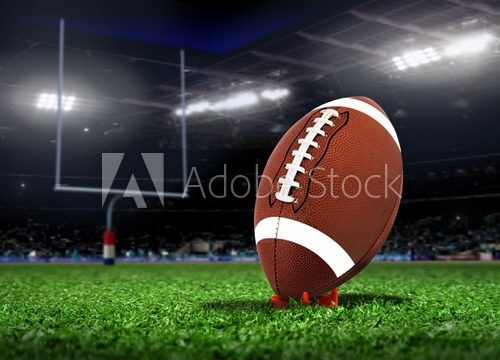 Football Ball On Grass in a Stadium