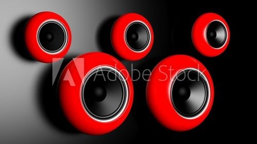 Red round speakers on on dark wall