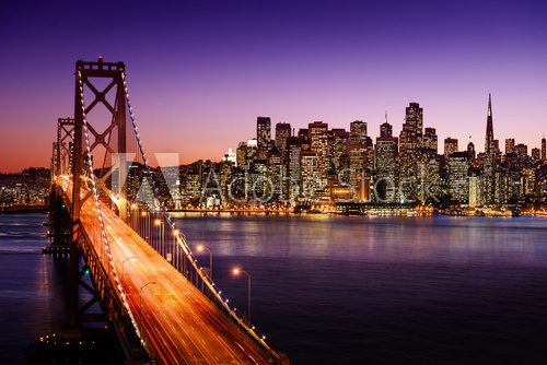 San Francisco skyline and Bay Bridge at sunset, California