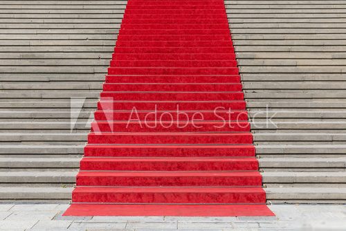 Stone staircase with red carpet