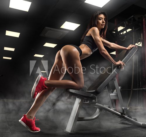 Beautiful sexy girl posing in the gym