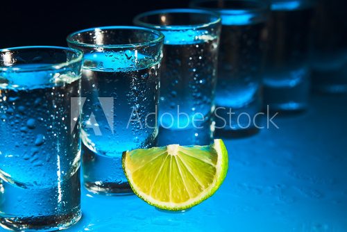 tequila and lime on glass table