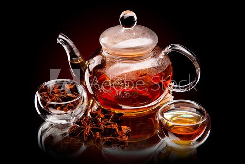 Cup of tea with teapot. With lemon and star anise