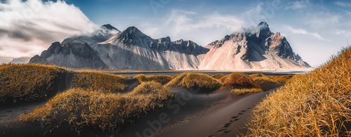Vestrahorn mountaine on Stokksnes cape in Iceland during sunset. Amazing Iceland nature seascape. popular tourist attraction. Best famouse travel locations. Scenic Image of Iceland