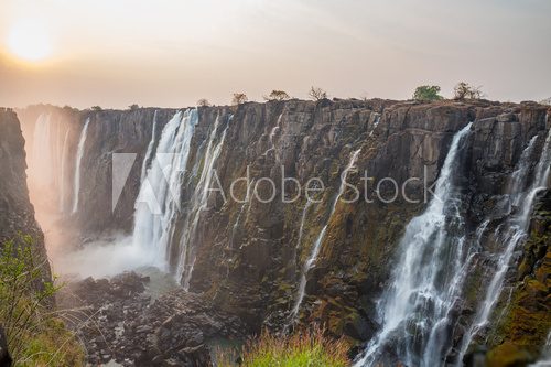 Victoria Falls sunset from Zambia side, red sun